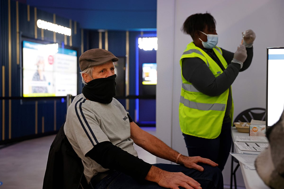 A Pharmacist prepares to give a dose of the AstraZeneca/Oxford Covid-19 vaccine at a temporary vaccine centre set up at an Odeon cinema complex in Maidstone, southeast England | AFP