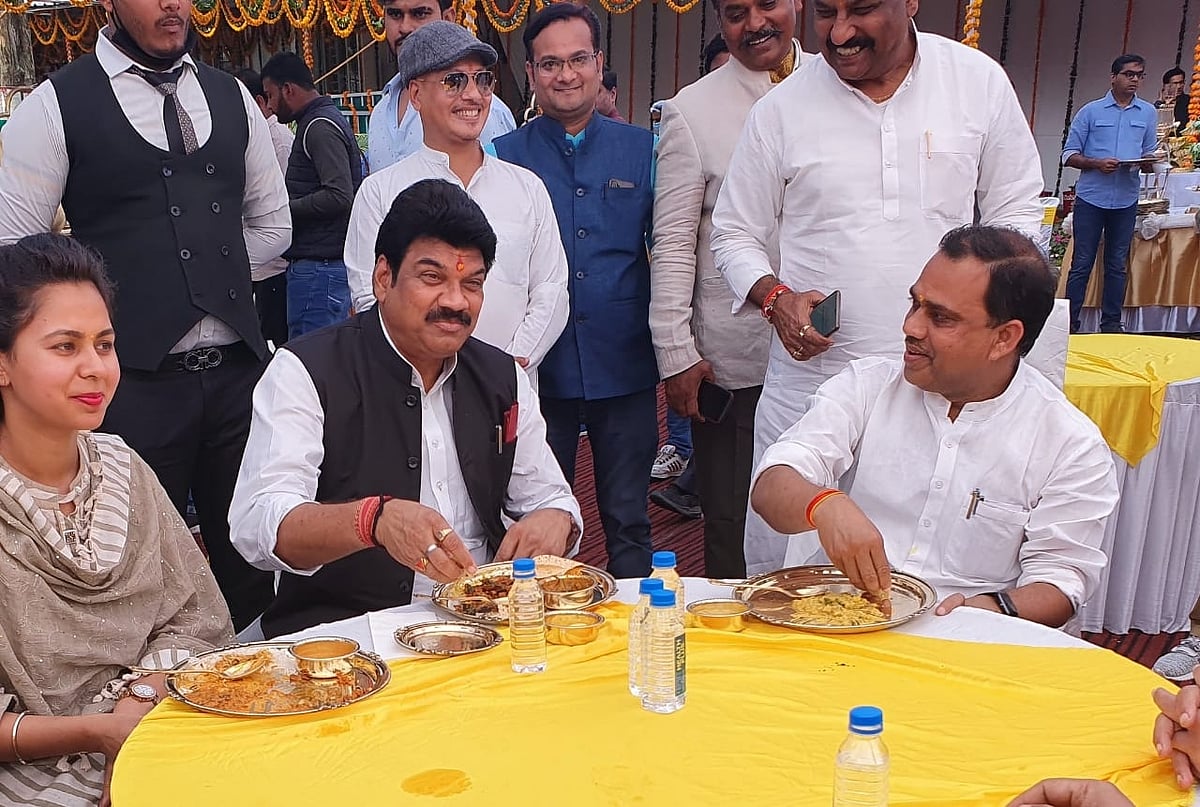 ROME WAS BURNING, NERO WAS PLAYING FLUTE:  Transport Minister Govind Rajput enjoys lunch hoisted by cooperative minister when dozens of passengers were killed after bus plunges in Bansagar canal, Sidhi district on Tuesday. 