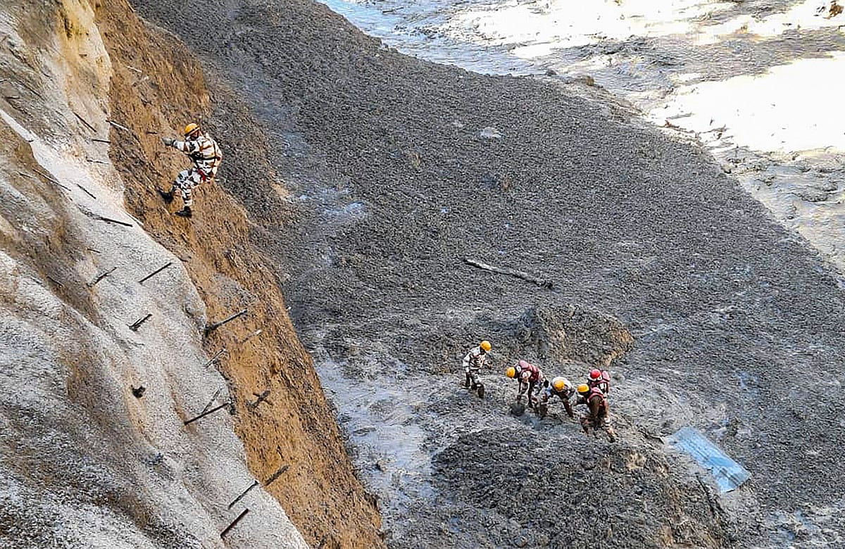 Chamoli: ITBP personnel dig to open Tapovan Tunnel which is completely blocked, after a glacier broke off in Joshimath in Uttarakhand?s Chamoli district causing a massive flood in the Dhauli Ganga river, Sunday, Feb. 7, 2021. More than 150 labourers working at the Rishi Ganga power project may have been directly affected. 