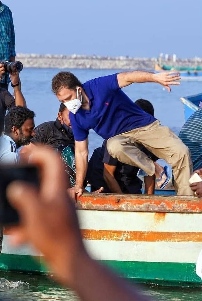 Kerala, Feb 24 (ANI): Congress leader Rahul Gandhi jumps off from boat after catching fish with the fishermen, at Thangassery Beach in Kollam on Wednesday.