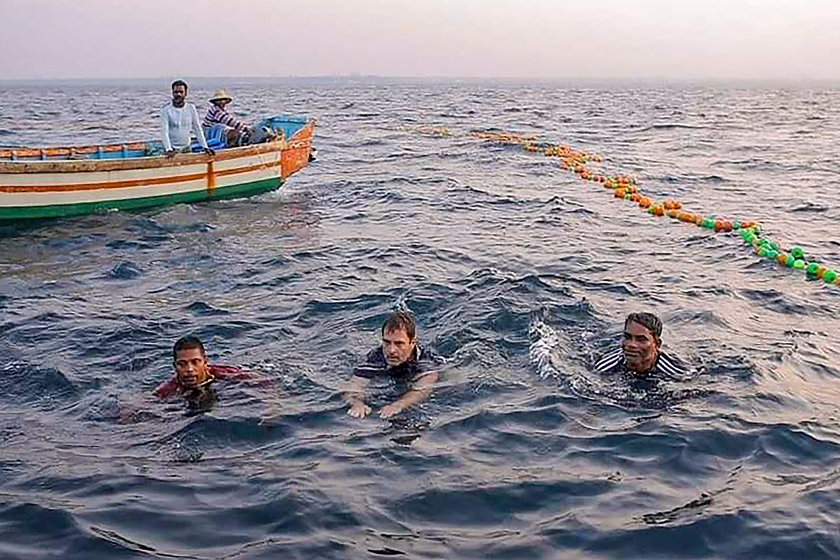 Kollam: Congress leader Rahul Gandhi (C) joins fishermen as they toil for the morning catch on the high-sea, in Kollam, Wednesday, Feb. 24, 2021.