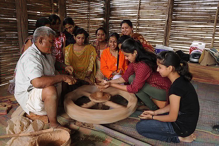 Students learn pottery 