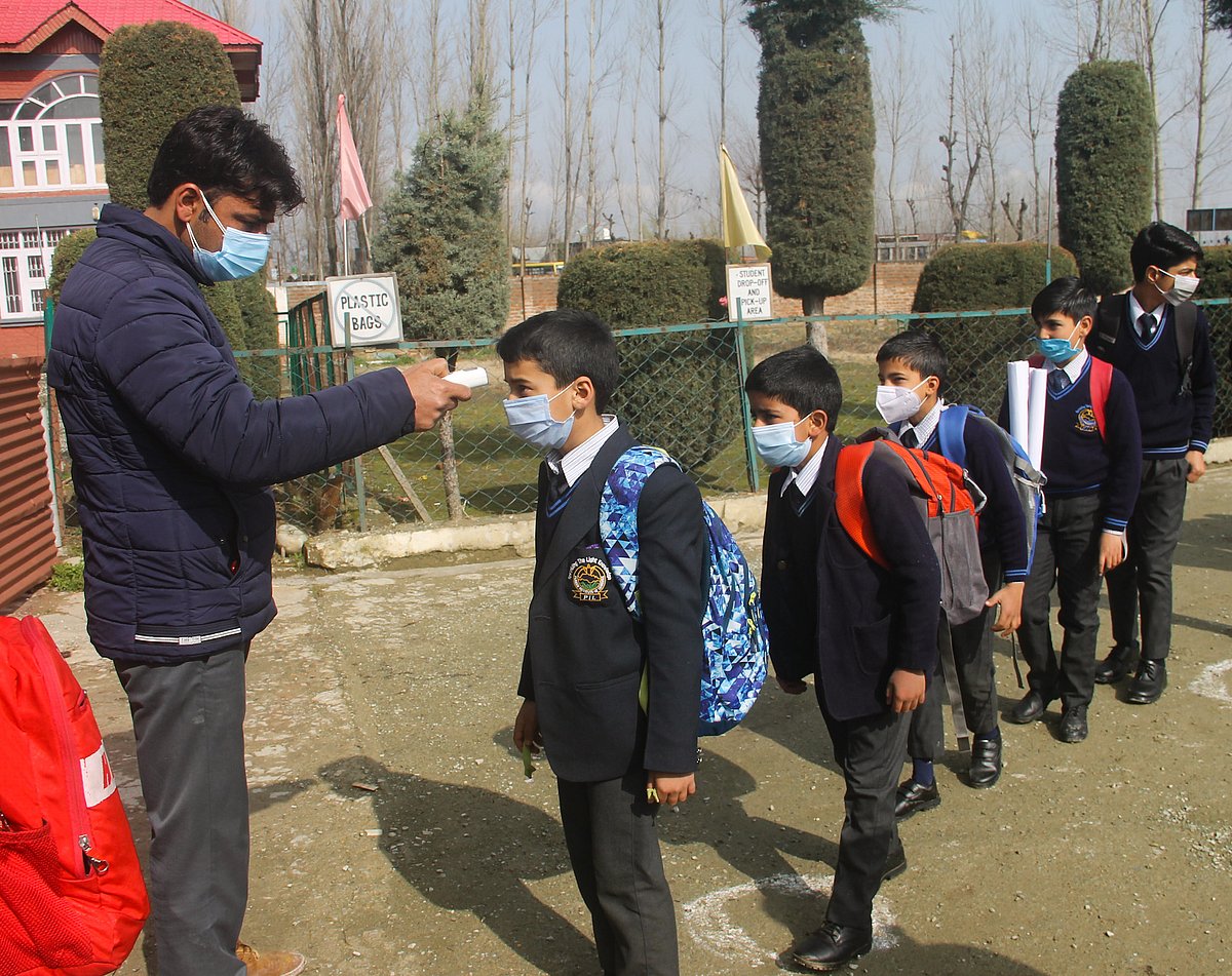 Primary school students being thermal screened on the first day of schools reopening for them after the Covid-19 induced closure, on March 15, 2021 in Srinagar, Kashmir.