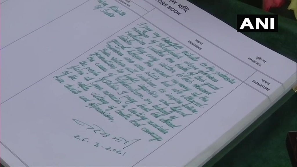 Bangladesh: Prime Minister Narendra Modi signs the visitors' book at National Martyrs' Memorial in Dhaka.