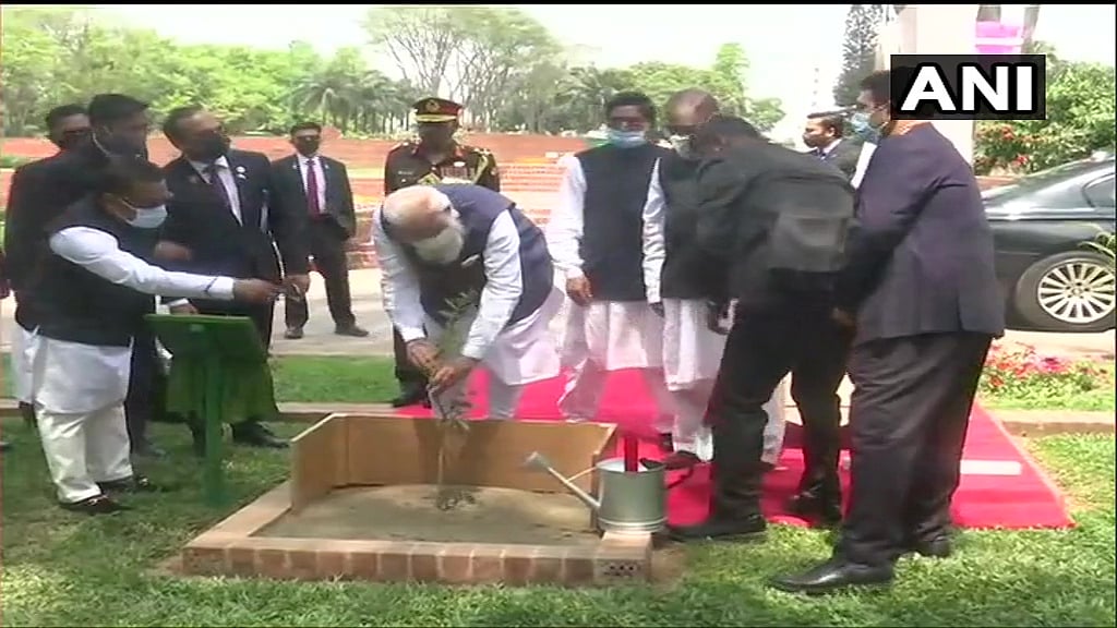 Bangladesh: Prime Minister Narendra Modi plants a sapling at National Martyrs' Memorial in Dhaka.