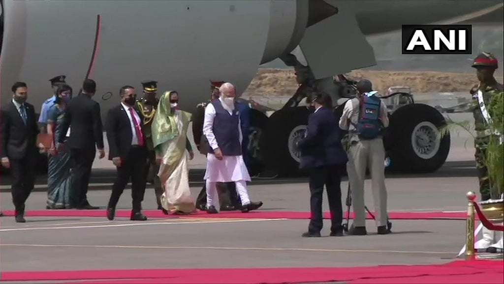 Prime Minister of Bangladesh, Sheikh Hasina receives PM Narendra Modi. Visuals from Hazrat Shahjalal International Airport in Dhaka.