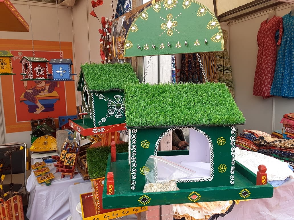 Colourful wooden bird nesters and feeders 