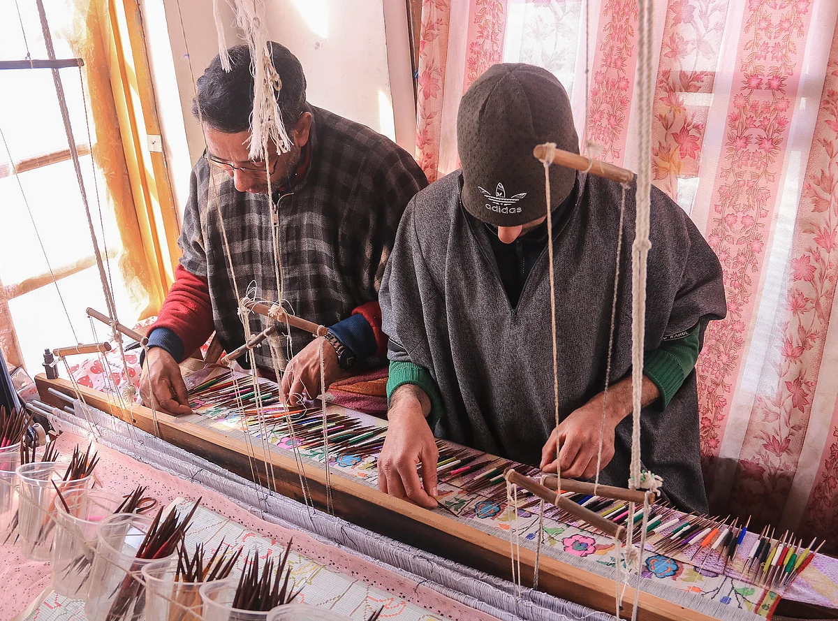 Artisans weave Kani Shawl from Pashmina yarn, at Kanihama Village of Budgam district, in the west of Srinagar city.
