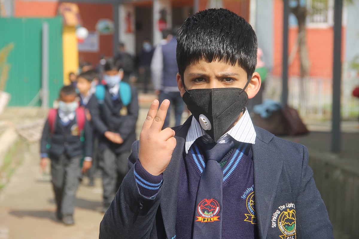 Students of junior wing attending classes on the first day of school as they reopen after almost a year, at Srinagar, kashmir.