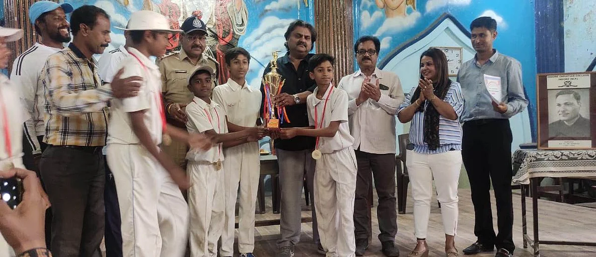 Winners with cricket trophy
