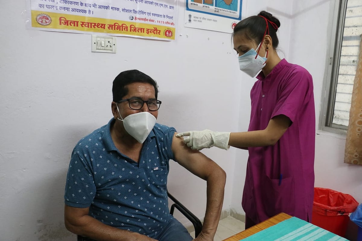 A resident is all smiles while receiving injection at PC Sethi Hospital