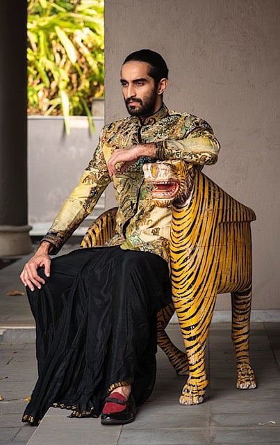 A black dhoti teamed with flash-hued coat