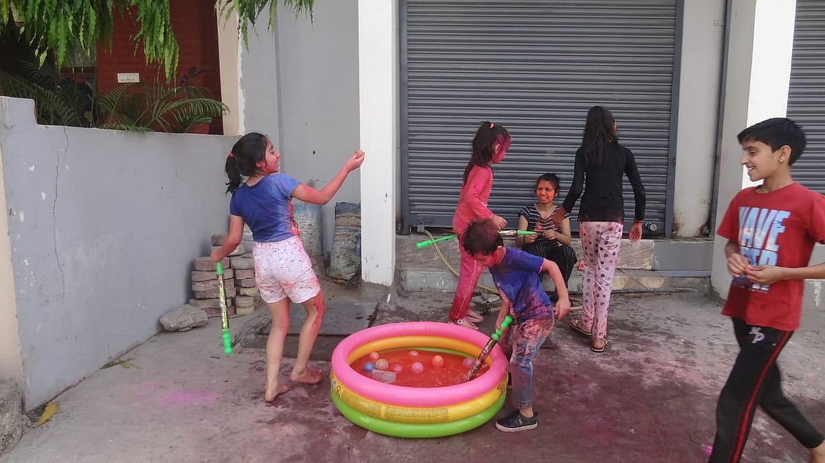 Children play with colours on Rangpanchami in Indore on Friday