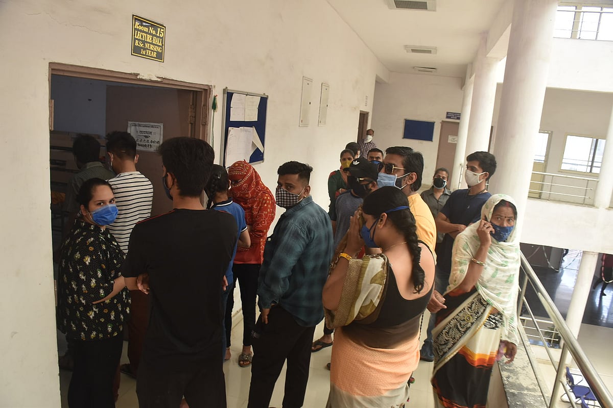 Rush for Jab Job: People thong vaccination centre in Nursing College at Sudama Nagar in Ujjain on Tuesday. 