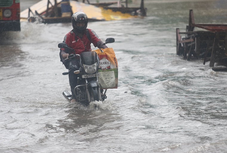A commuter in a waterlogged area