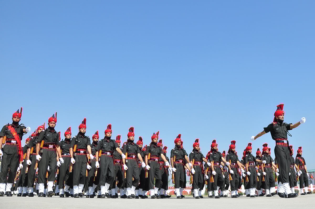 New recruits of the Jammu and Kashmir Light Infantry Regiment (JKLIR) conduct the passing out parade at the army base on the outskirts of Srinagar, on Friday, 25 June 2021.