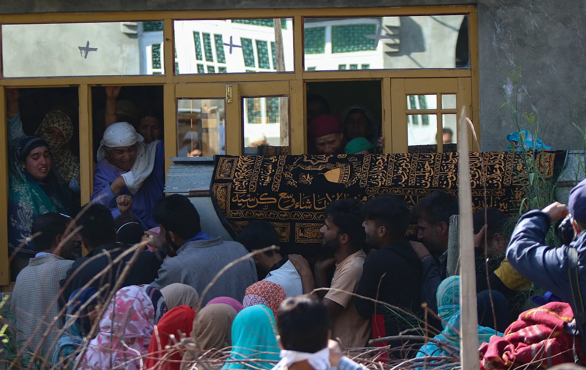 Villagers carry the body of the daughter of Fayaz Ahmed, former SPO of Jammu & Kashmir Police. Ahmed, his wife, and daughter, were killed by suspected militants in Hariparigam village of Pulwama district in Kashmir on June 27, 2021.