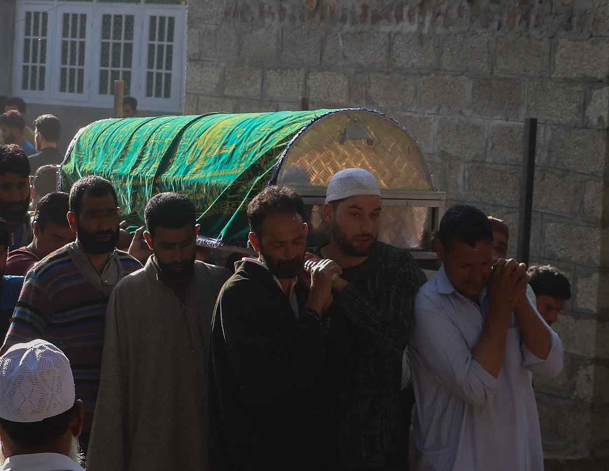 Villagers carry the body for the funeral of Fayaz Ahmed, former SPO of Jammu & Kashmir Police, who was killed along with his daughter, and wife by suspected militants, in Hariparigam village of Pulwama district of Kashmir on June 27, 2021.
