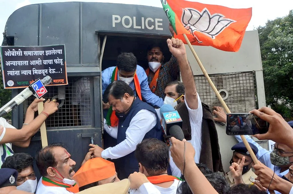 BJP Leader Pravin Darekar with BJP cadre during the protest.