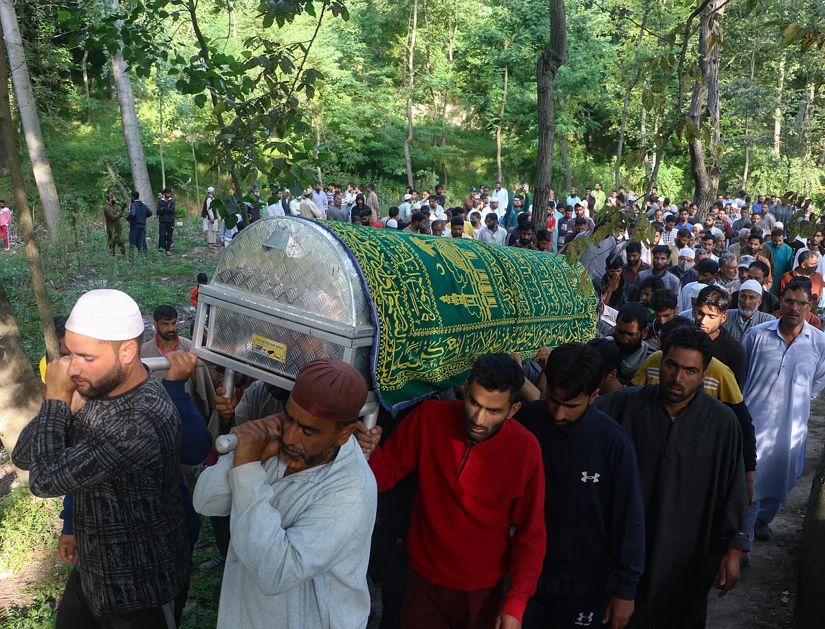 Villagers carry the body for the funeral of Fayaz Ahmed, former SPO of Jammu & Kashmir Police, who was killed along with his daughter, and wife by suspected militants, in Hariparigam village of Pulwama district in Kashmir on June 27, 2021.
