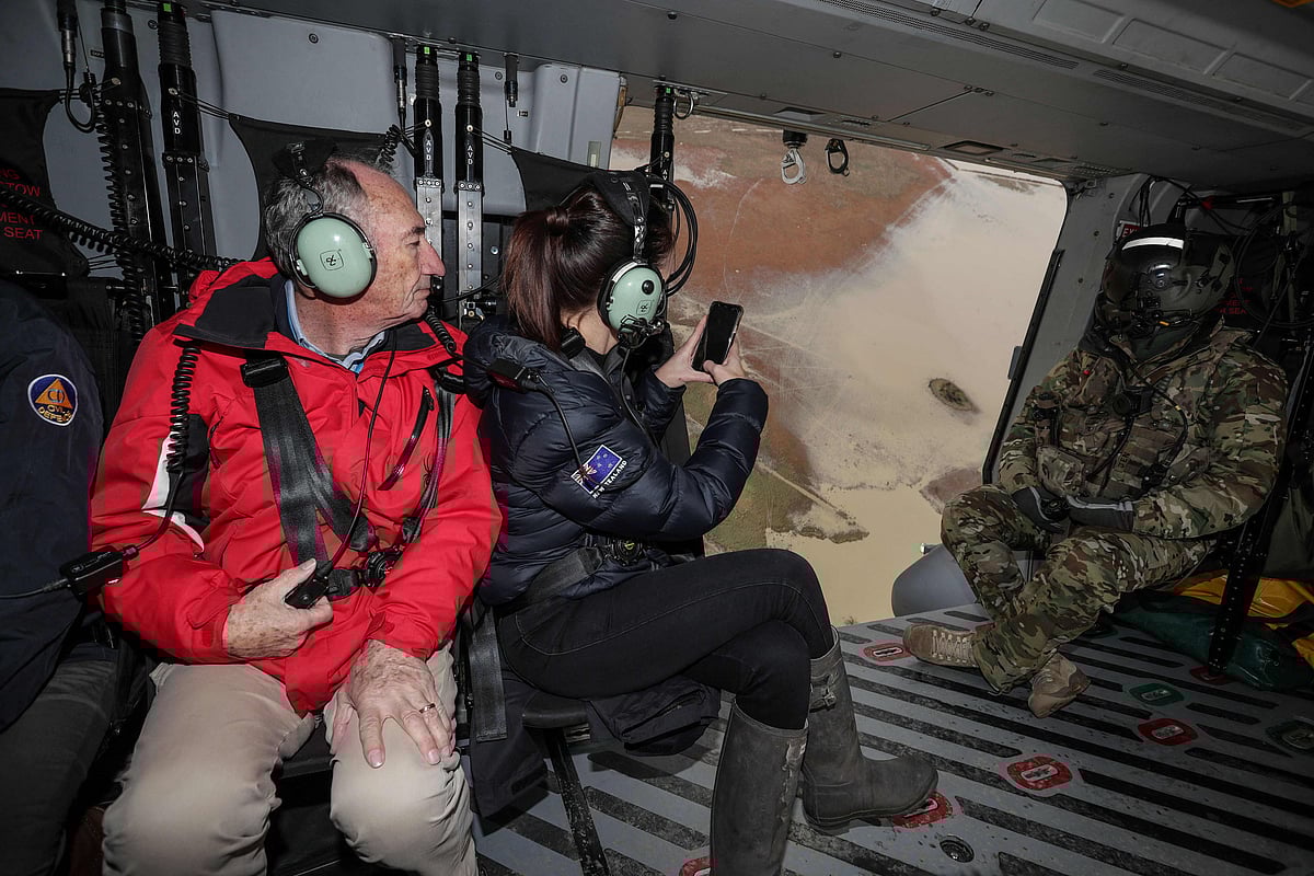 New Zealands Prime Minister Jacinda Ardern (C) inspects the flood damage from an army helicopter on June 1, 2021 after heavy rains washed away bridges and cut roads in the Canterbury region.