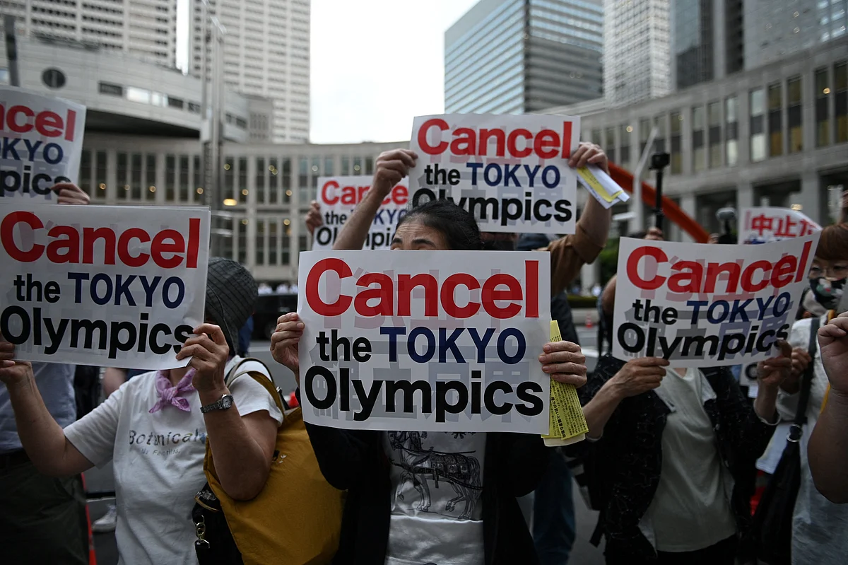 A group of anti-Olympic activists takes part in a protest outside the metropolitan government building to mark the 30 days before the Olympic Games opening ceremonies, in Tokyo on June 23, 2021.
