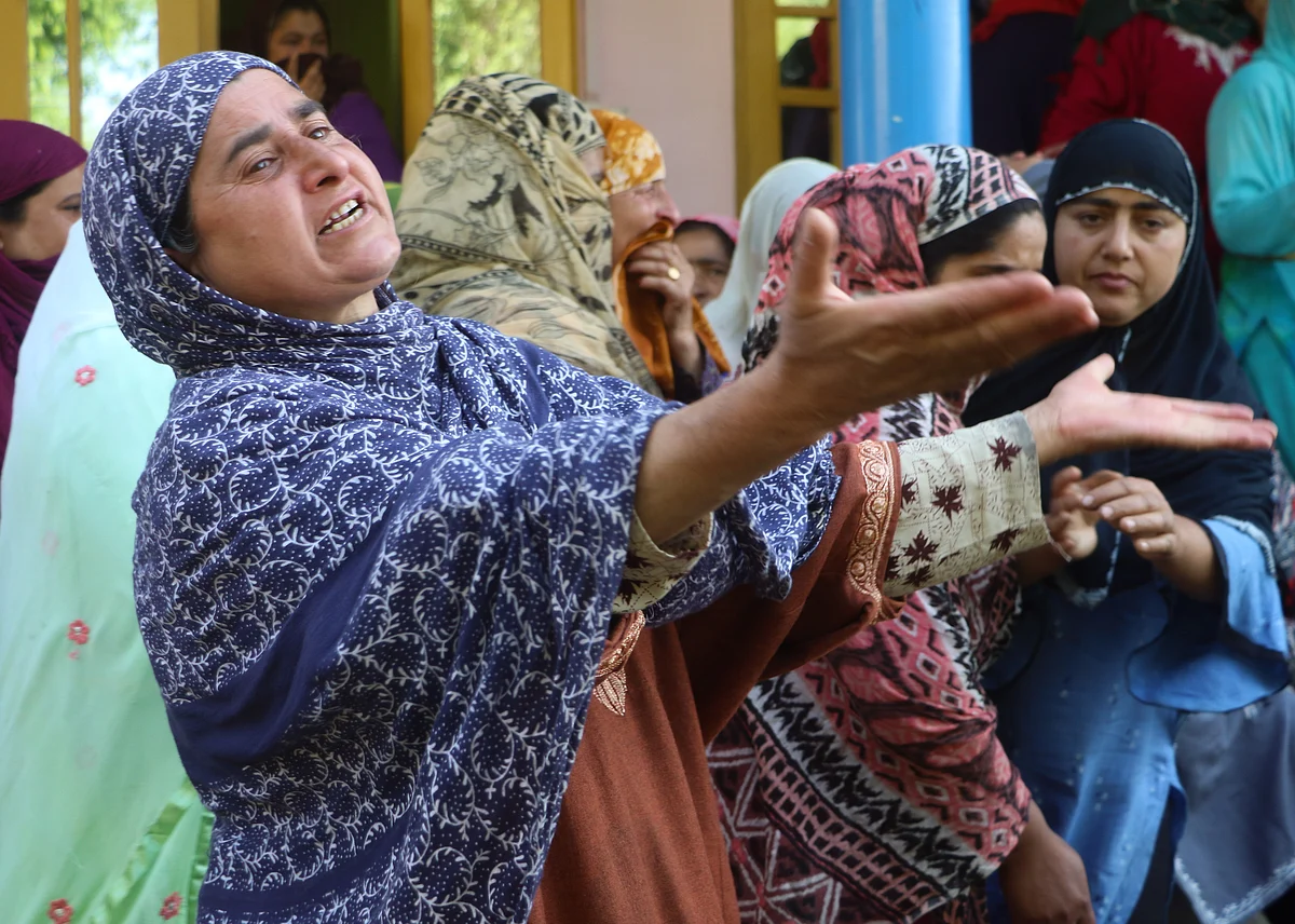 Relatives mourn the death of the daughter of Fayaz Ahmed, former SPO of Jammu & Kashmir Police. Ahmed, his wife, and daughter, were killed by suspected militants in Hariparigam village of Pulwama district in Kashmir on June 27, 2021.