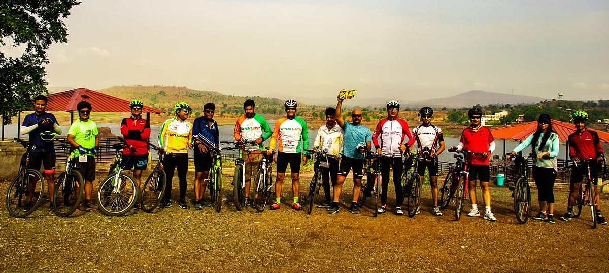 Group of cyclists on airport road for Environment Day ride