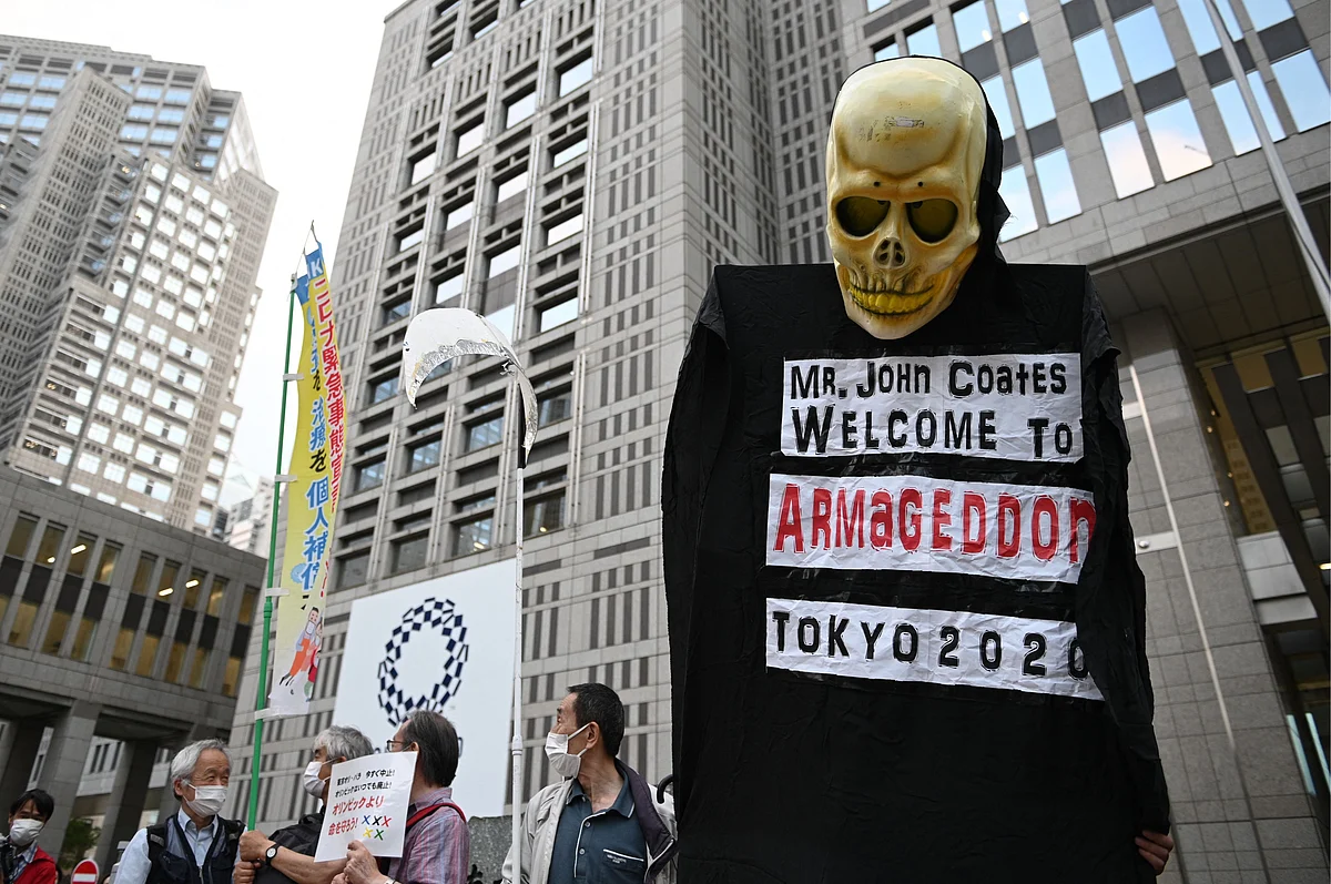 A group of anti-Olympic activists takes part in a protest outside the metropolitan government building to mark the 30 days before the Olympic Games opening ceremonies, in Tokyo on June 23, 2021.