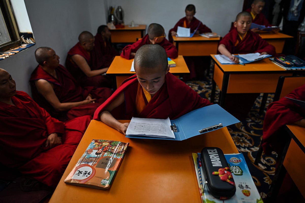 This photograph taken during a government organised media tour in Lhasa, China's central Tibet Autonomous Region, on May 31, 2021 shows young monks studying at the Tibet Autonomous Region Buddhist College. 