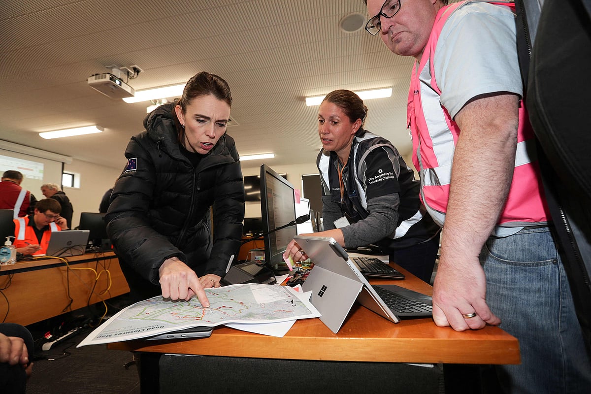 New Zealands Prime Minister Jacinda Ardern (L) visits the Emergency Operation Centre in Ashburton on June 1, 2021 as she inspects the flood damage after heavy rains washed away bridges and cut roads in the Canterbury region. 