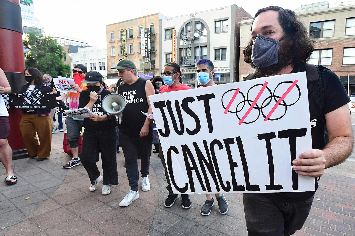 Members of NOlympics LA and their supporters gather in Little Tokyo in Los Angeles, California on June 22, 2021 calling for the cancellation of the Tokyo 2020 Olympics.