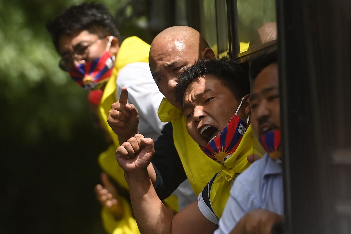 Activists of the Tibetan Youth Congress (TYC) international non-governmental organization shout slogans as they are detained by police during a protest outside the China embassy on the occasion of the 100th anniversary of the founding of the Chinese Communist party, in New Delhi on July 1, 2021.
