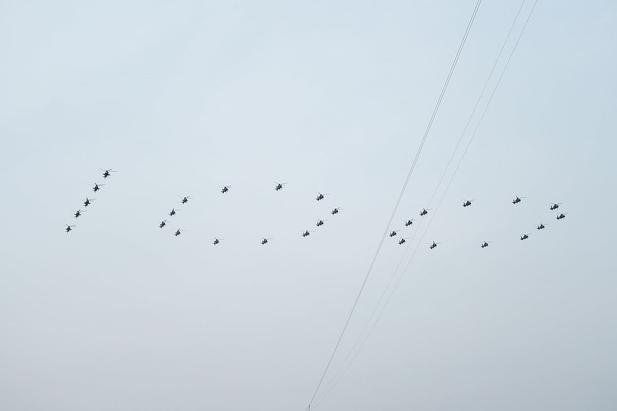 Helicopters fly in formation making the sign 100 over Tiananmen Square during the celebrations marking the 100th anniversary of the founding of the Communist Party of China in Beijing on July 1, 2021.