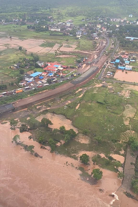 In this handout photo taken on July 23, 2021, by the Indian Navy shows areas inundated with flood water after heavy monsoon rains in Raigad district of Maharashtra
