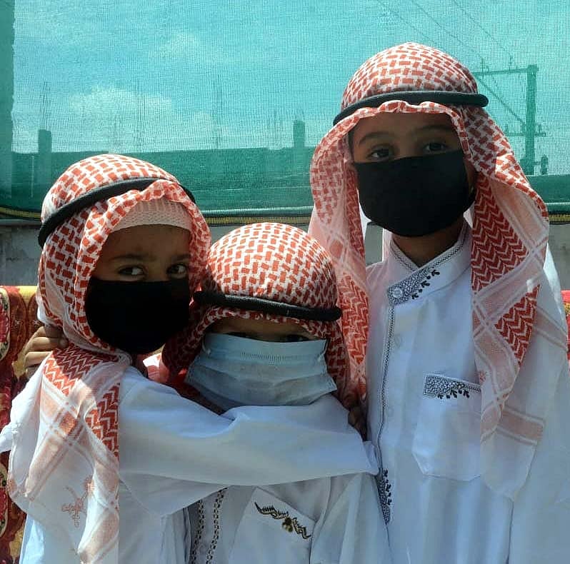 Happiness arrives: Children hugging each other on the occasion of Eid-ul-Azha, in Bhopal, on Wednesday