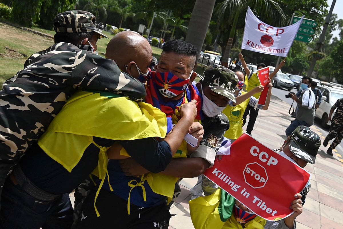 Activists of the Tibetan Youth Congress (TYC) international non-governmental organization shout slogans as they are detained by police during a protest outside the China embassy on the occasion of the 100th anniversary of the founding of the Chinese Communist party, in New Delhi on July 1, 2021. 