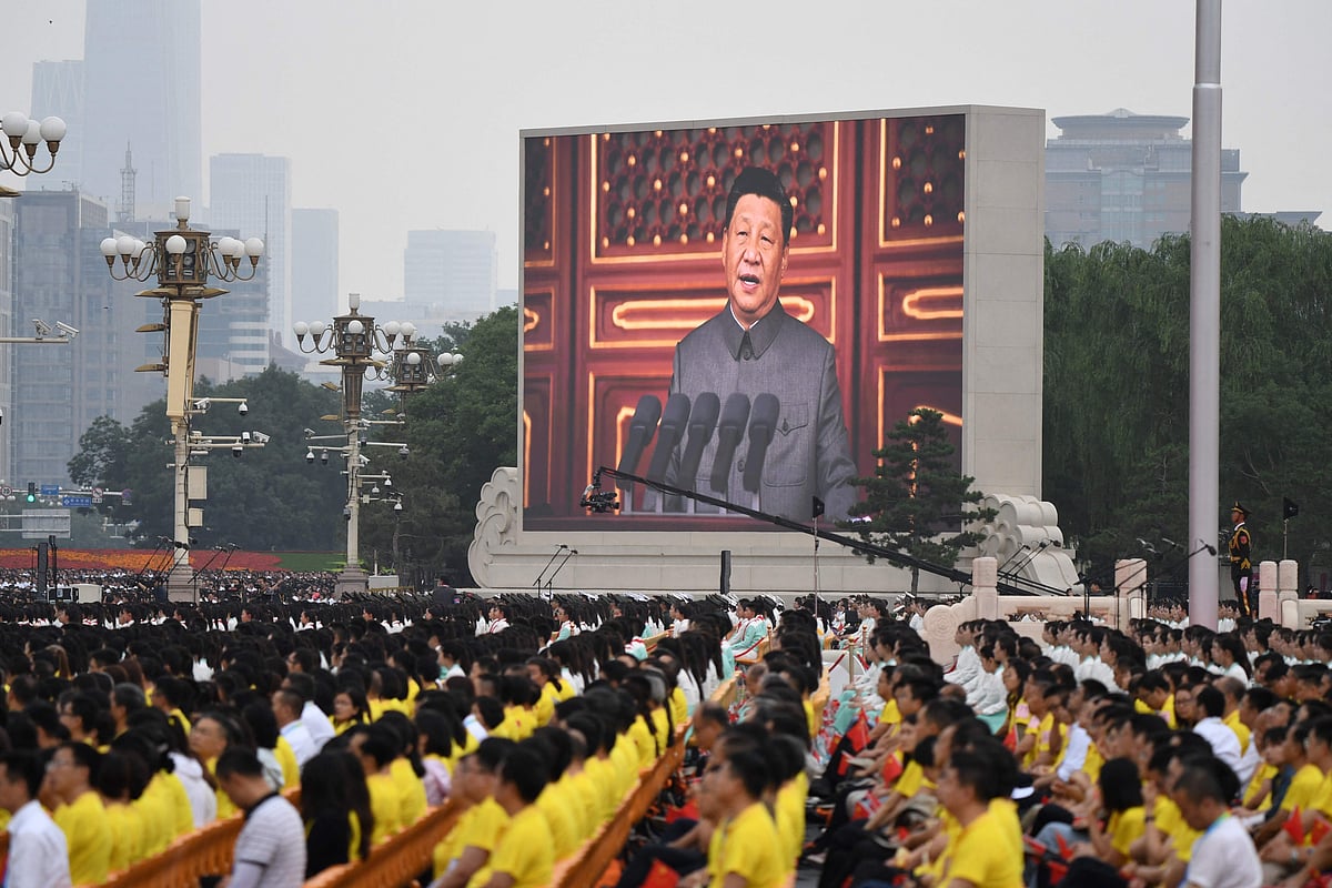 Chinese President Xi Jinping (C) delivers a speech during the celebration of the 100th anniversary of the founding of the Communist Party of China at Tiananmen Square in Beijing on July 1, 2021.