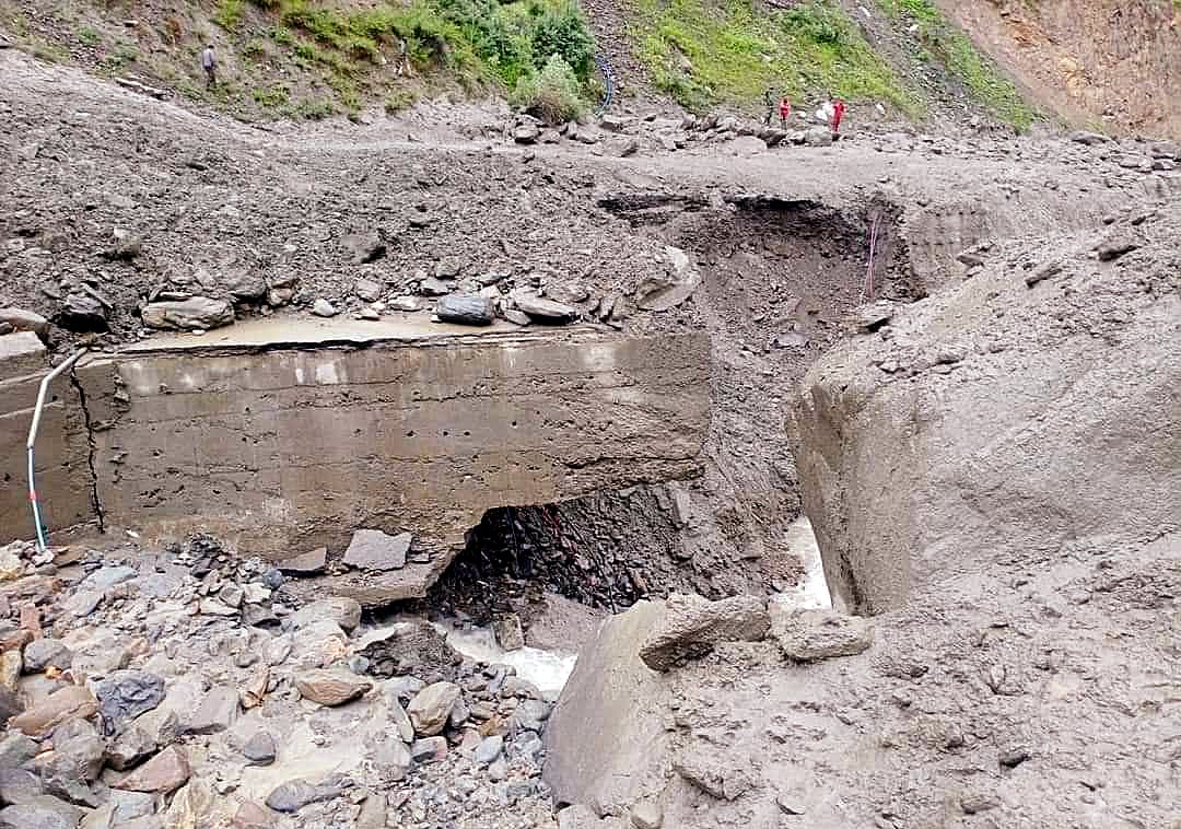 A road got damaged due to the heavy rainfall, in Kishtwar,Jammu and Kashmir on Wednesday. 