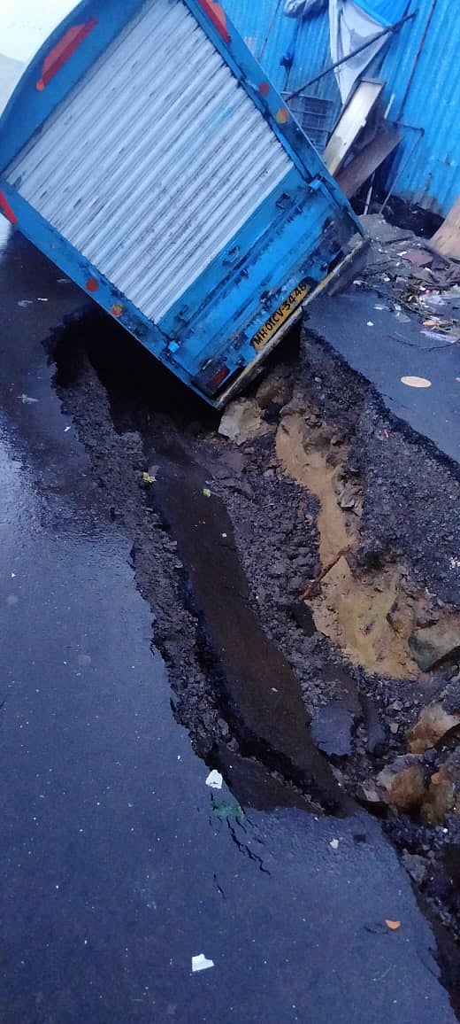A parked tempo get stuck between the cracked road