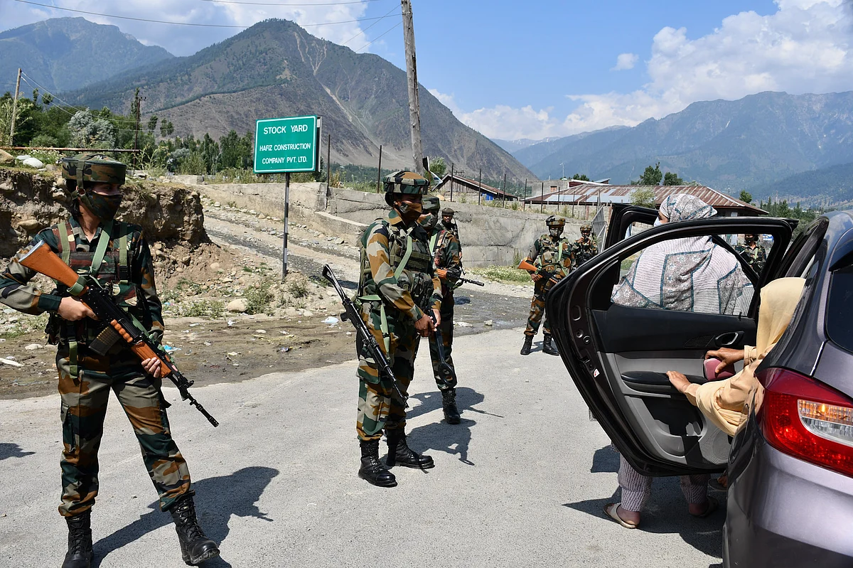 The soldiers screen commuters at Wasun, in Ganderbal district of Kashmir