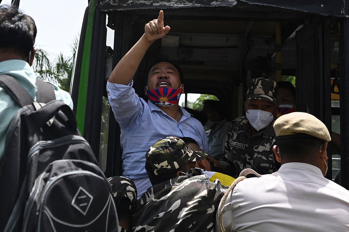 Activists of the Tibetan Youth Congress (TYC) international non-governmental organization shout slogans as they are detained by police during a protest outside the China embassy on the occasion of the 100th anniversary of the founding of the Chinese Communist party, in New Delhi on July 1, 2021.