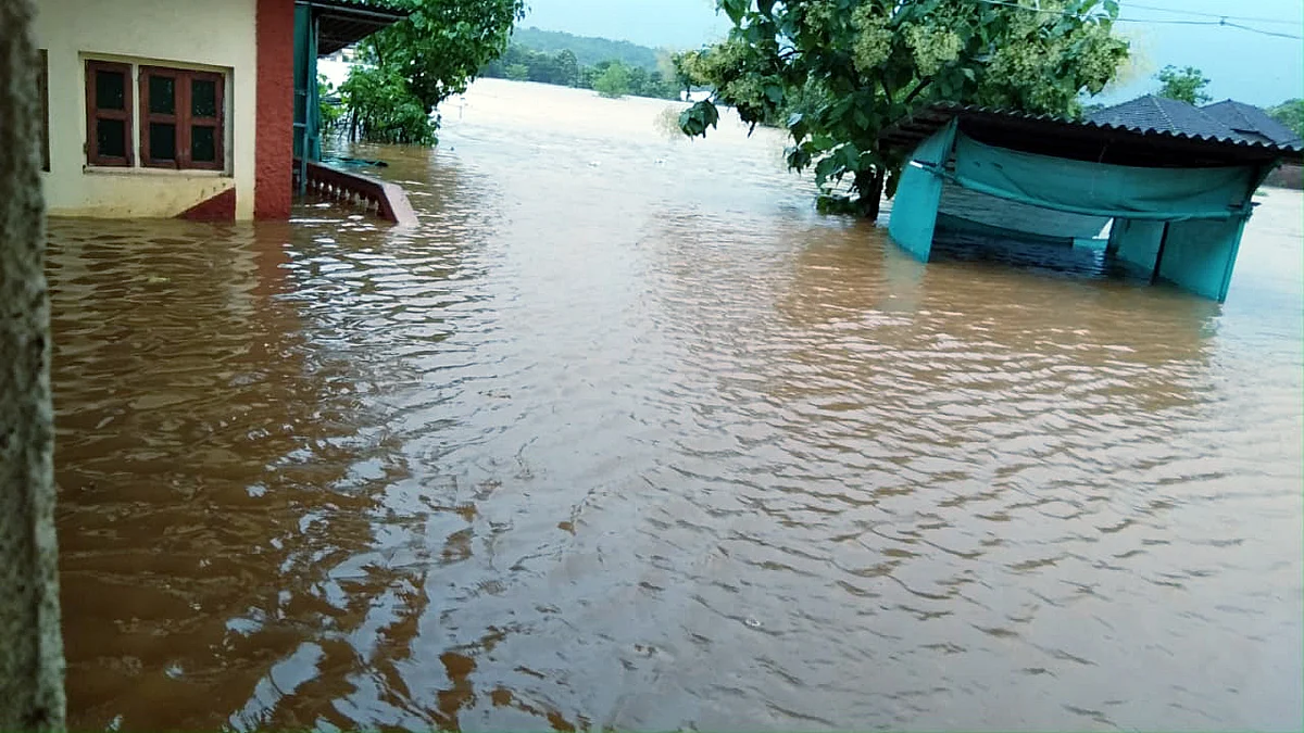 Houses get partially submerged as streets flooded due to heavy rainfall, in Ratnagiri on Thursday.