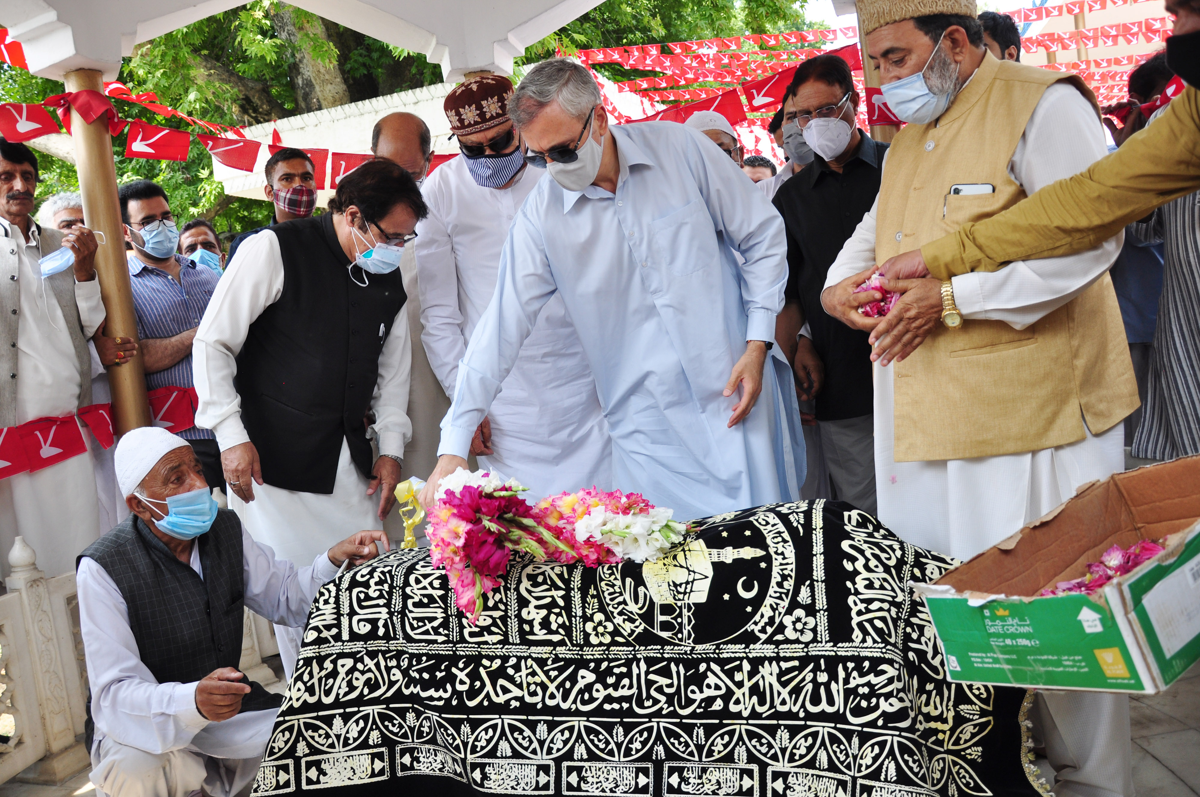 Jammu and Kashmir National Conference President and MP Dr. Farooq Abdullah, son Omar Abdullah, and senior party leaders pay tributes to Begum Akbar Jehan, MP and wife of JKNC founder Sheikh Muhammad Abdullah on her 21st death anniversary at her grave Hazratbal in Srinagar on Sunday, July 11,2021.