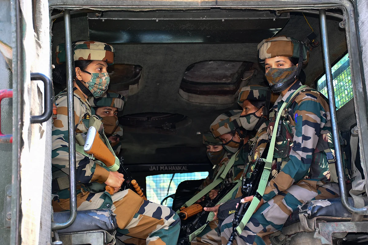 The soldiers on guard in an armoured vehicle along Srinagar-Leh highway at Wasun in Ganderbal district of Kashmir