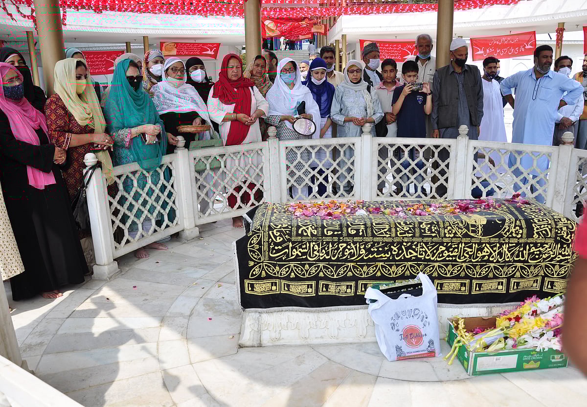 Jammu and Kashmir National Conference members pay tributes to Begum Akbar Jehan, ex-MP and wife of National Conference founder Sheikh Muhammad Abdullah on her 21st death anniversary at her grave Hazratbal in Srinagar on Sunday, July 11,2021
