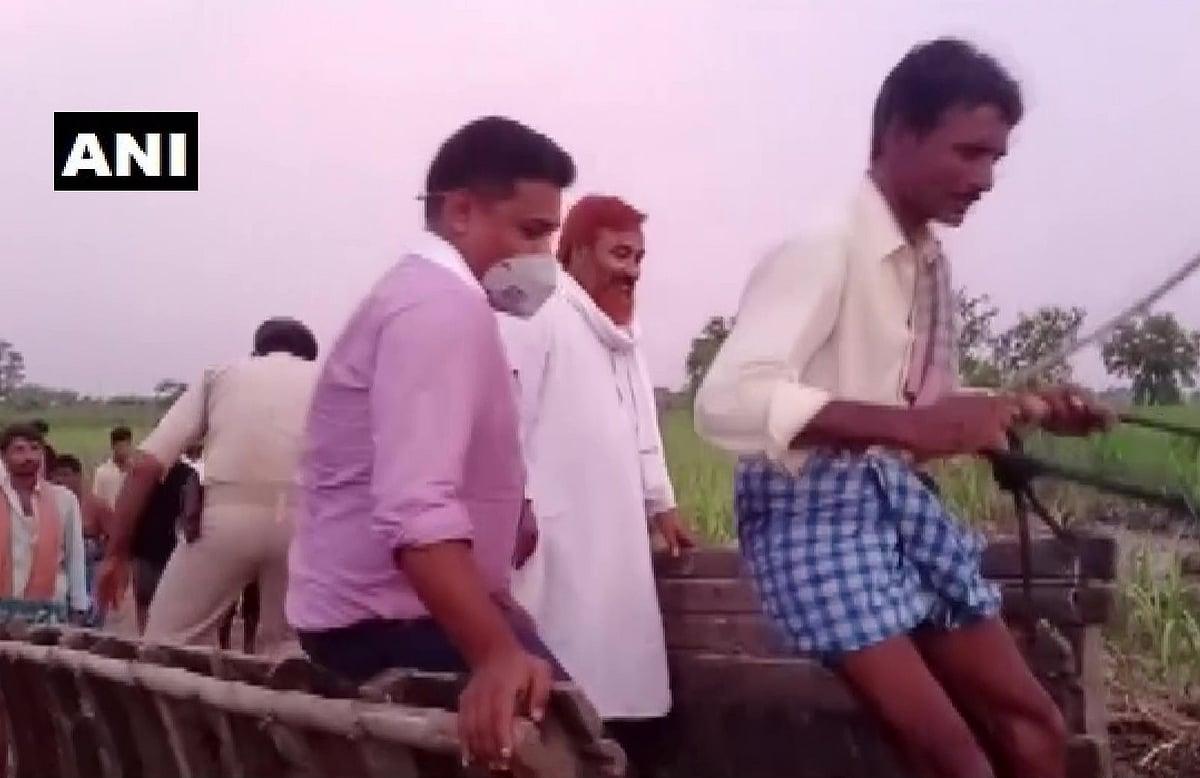 Bagaha SDM Shekhar Anand rode a buffalo cart to reach a river embankment in the flood-affected Ramnagar area in East Champaran, Bihar on July 5, 2021.