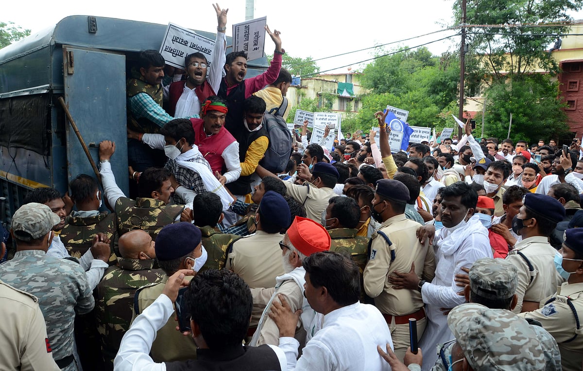 Police detaining the protesters in Bhopal on Wednesday.