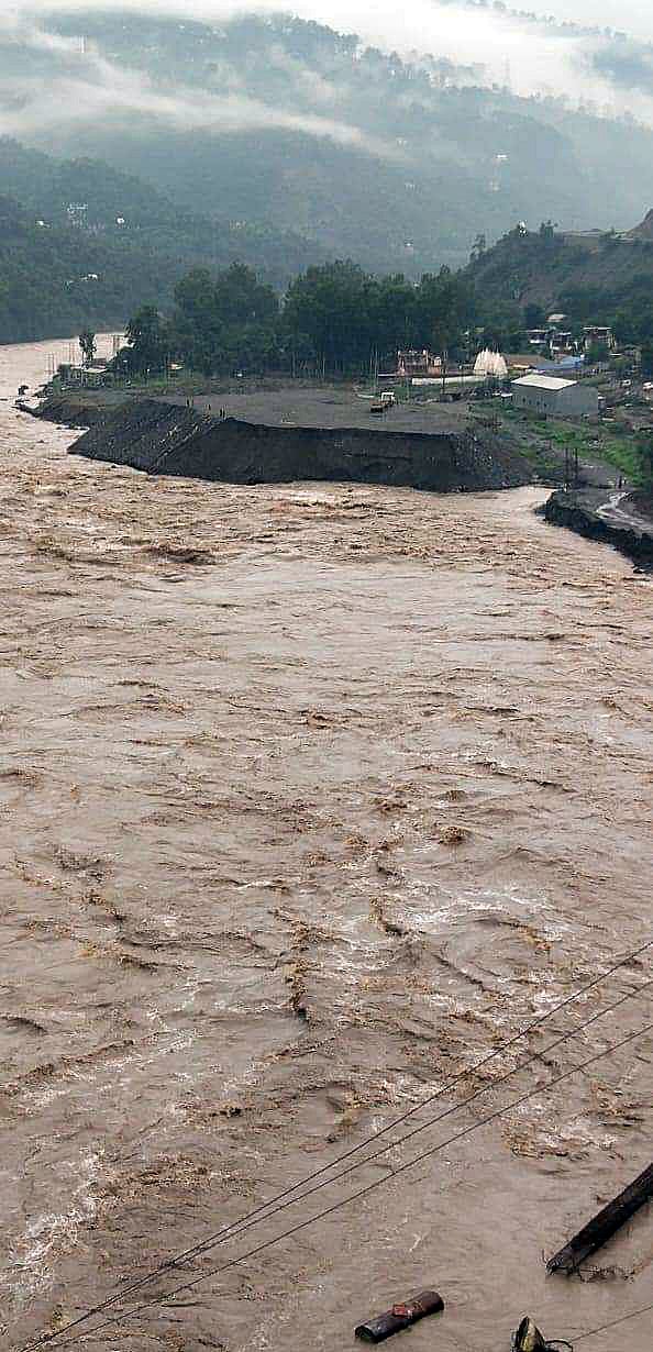 The water level of the Chenab river rises due to the heavy rainfall, in Kishtwar, Jammu and Kashmir on Wednesday. 