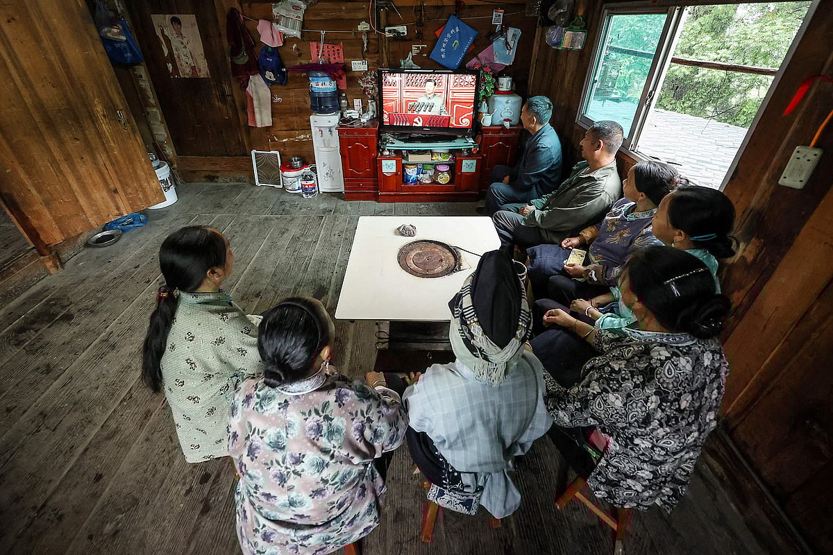 People of the Shui ethnic minority watch the celebrations to mark the 100th anniversary of the founding of the Communist Party of China in Danzhai, in Chinas southwestern Guizhou province on July 1, 2021.
